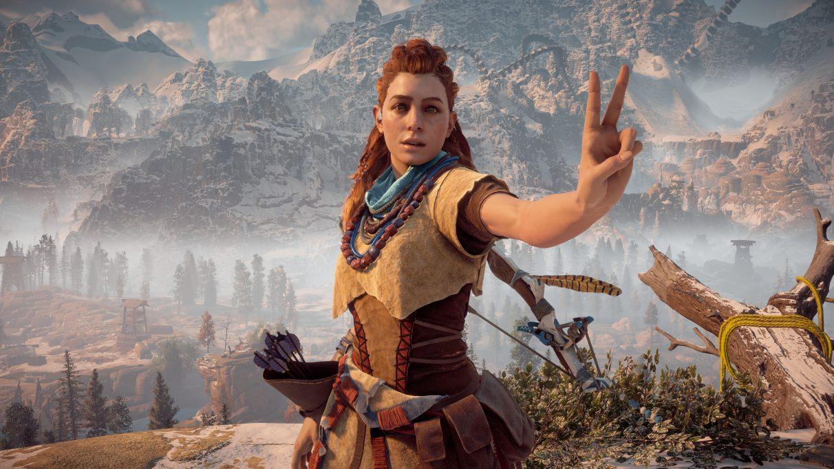 A screenshot of Aloy from Horizon Zero Dawn doing the peace sign in the game's photo mode. 