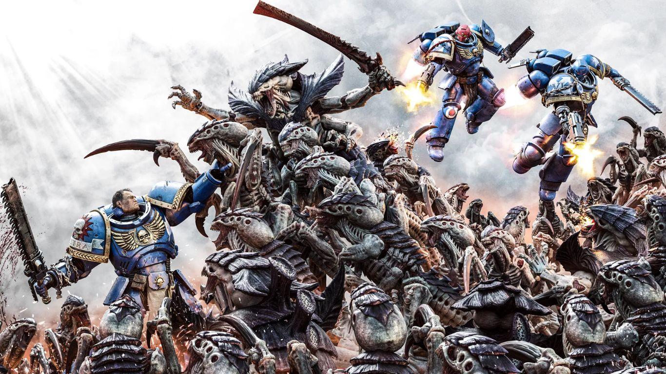 Expanded box art for Warhammer 40,000: Space Marine 2 featuring three Ultramarines fighting off a horde of Tyranids on a grey smoke background